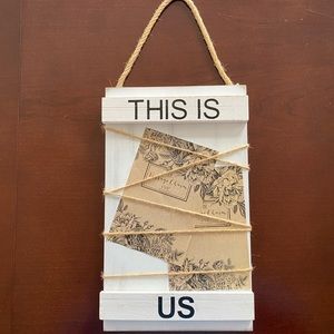 Frame. “This Is Us”.  Holds several 4x6 photos.  New.